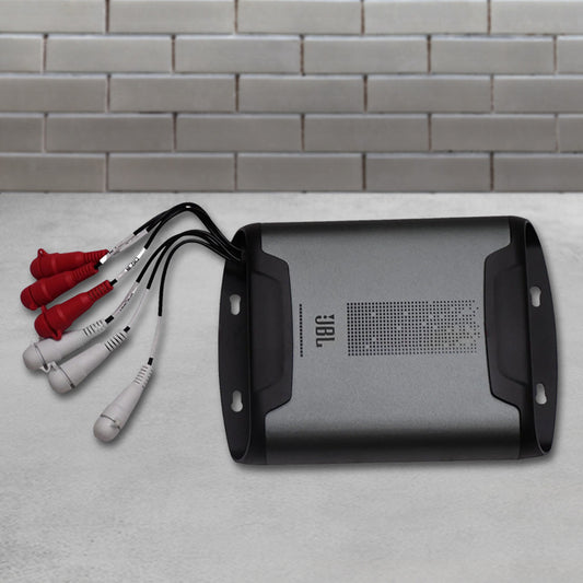 JBL DSP2544 compact 4-channel amplifier with integrated digital signal processor featuring a sleek black finish, labeled wiring harness, and USB tuning port.