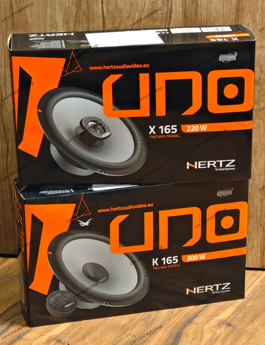 Hertz Uno series audio upgrade combo, featuring the K165 2-way component system on the left and the X165 coaxial system on the right, arranged for a professional car audio installation showcase.
