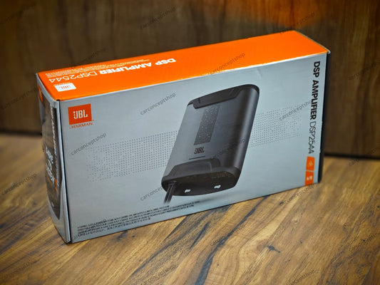 JBL DSP2544 compact 4-channel amplifier with integrated digital signal processor featuring a sleek black finish, labeled wiring harness, and USB tuning port.