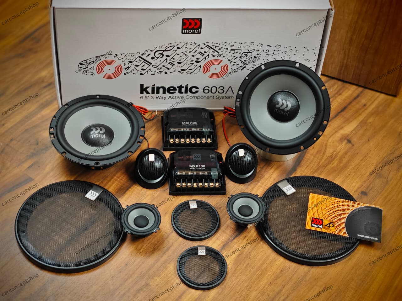 Morel Kinetic 603 3-way component speaker kit featuring 6.5-inch woofers, dedicated midrange drivers, neodymium tweeters, and external crossovers on a white background.