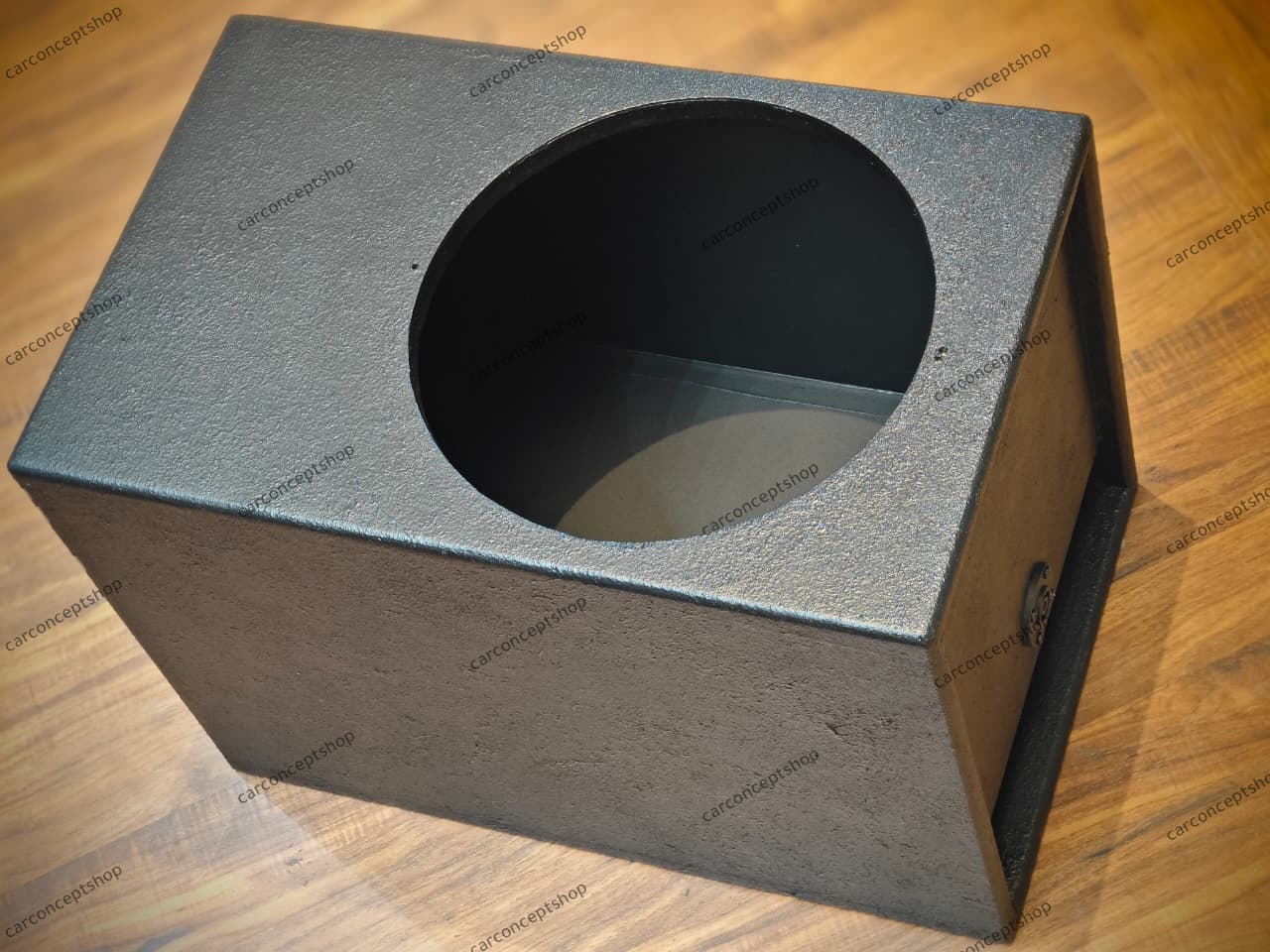Professional 12-inch subwoofer enclosure featuring a rugged black textured finish and a lower-side slot port.