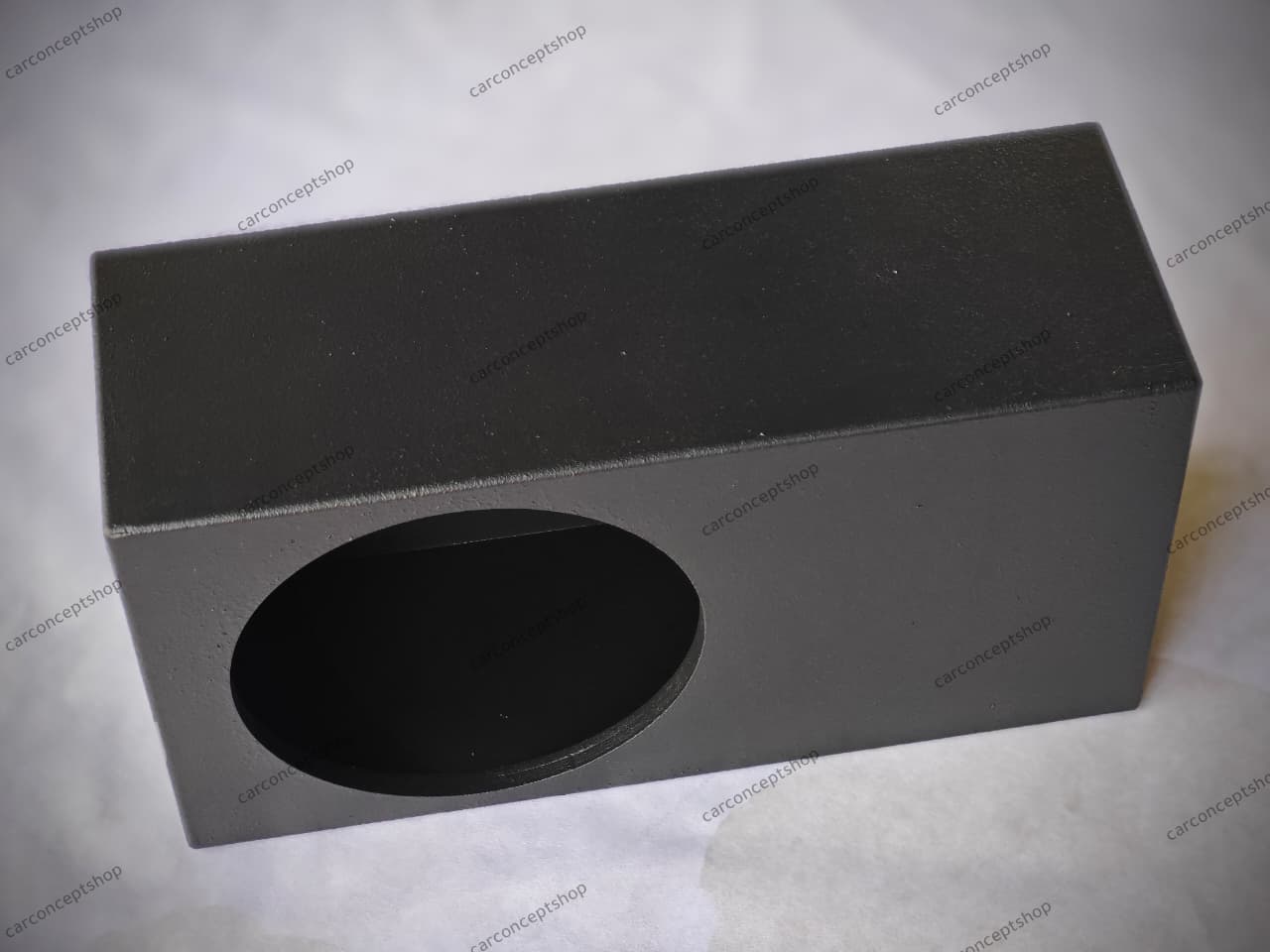 Front perspective of a 24.75-inch long ultra-slim 12-inch subwoofer enclosure with a rugged black finish.