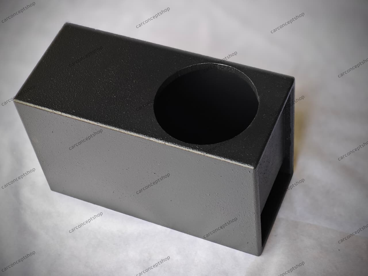 Front view of a professional 8-inch slim subwoofer enclosure with a lower-side slot port and rugged black finish.
